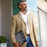 A business man carrying personalized microsoft surface case with Astronaut Space design in the park