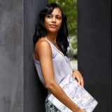 A yong girl holding personalized microsoft surface laptop case with Marble design